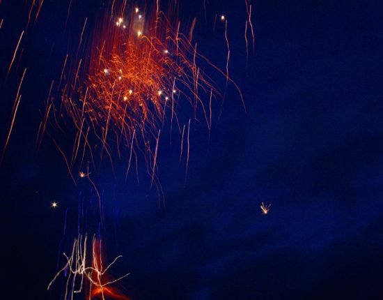 Spectacular fireworks against deep blue night sky